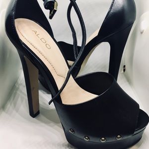 Black high heels with an ankle strap.